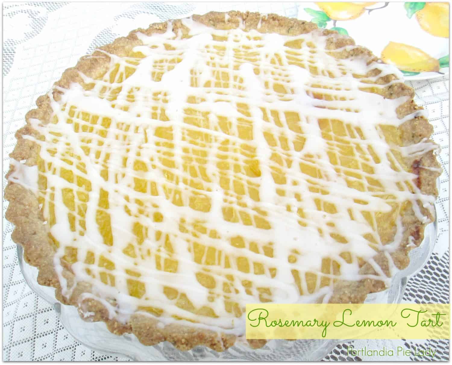 Luscious lemon curd filling, topped with a lemon drizzle, and baked in a rosemary-infused shortbread crust.  