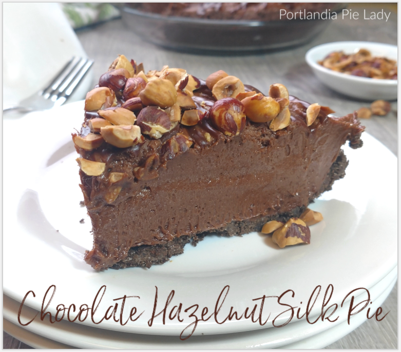 Chocolate Hazelnut Silk Pie topped with roasted hazelnuts, a little bit of ganache, and loads of creamy mascarpone cheese.  It truly melts in your mouth.