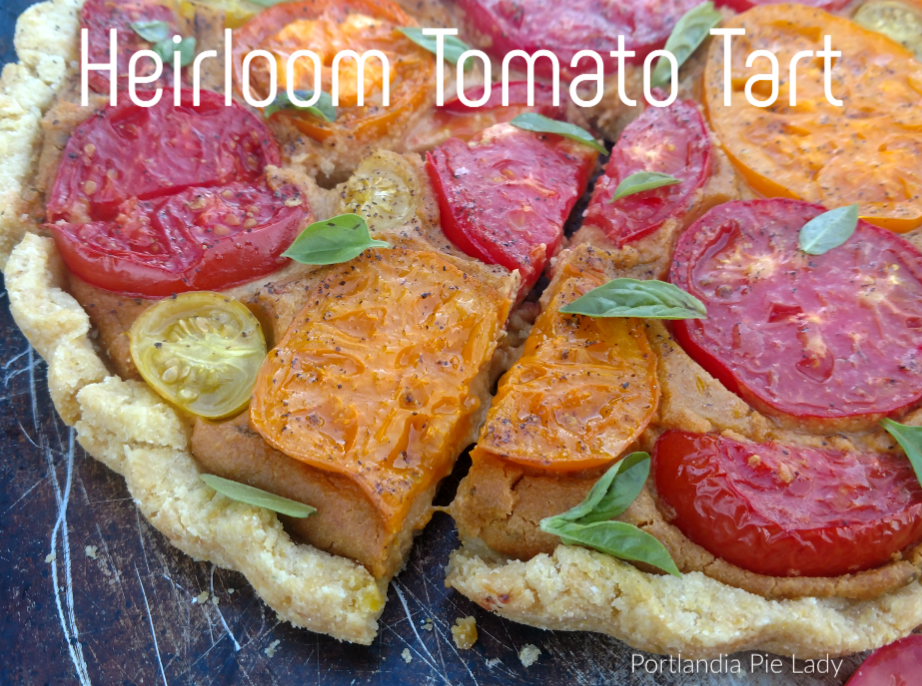 Heirloom Tomato Tart: Sweet fresh picked tomatoes baked in a cashew cream filling with a hint of lemon, garnished with basil in a tender corn masa crust.
