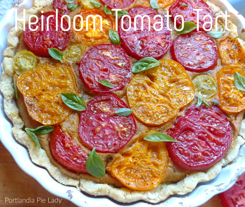 Heirloom Tomato Tart: Sweet fresh picked tomatoes baked in a cashew cream filling with a hint of lemon, garnished with basil in a tender corn masa crust.