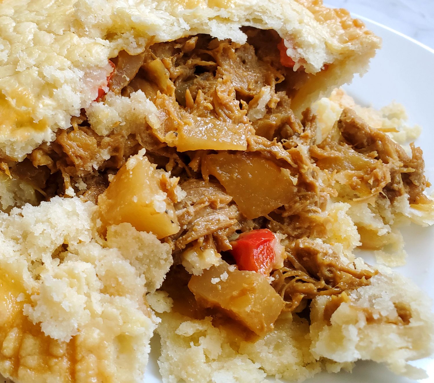 Smoky roasted pulled pork with chopped apples, potatoes baked with a tangy-sweet Carolina BBQ sauce, and ultra flaky English Wig pie crust.  