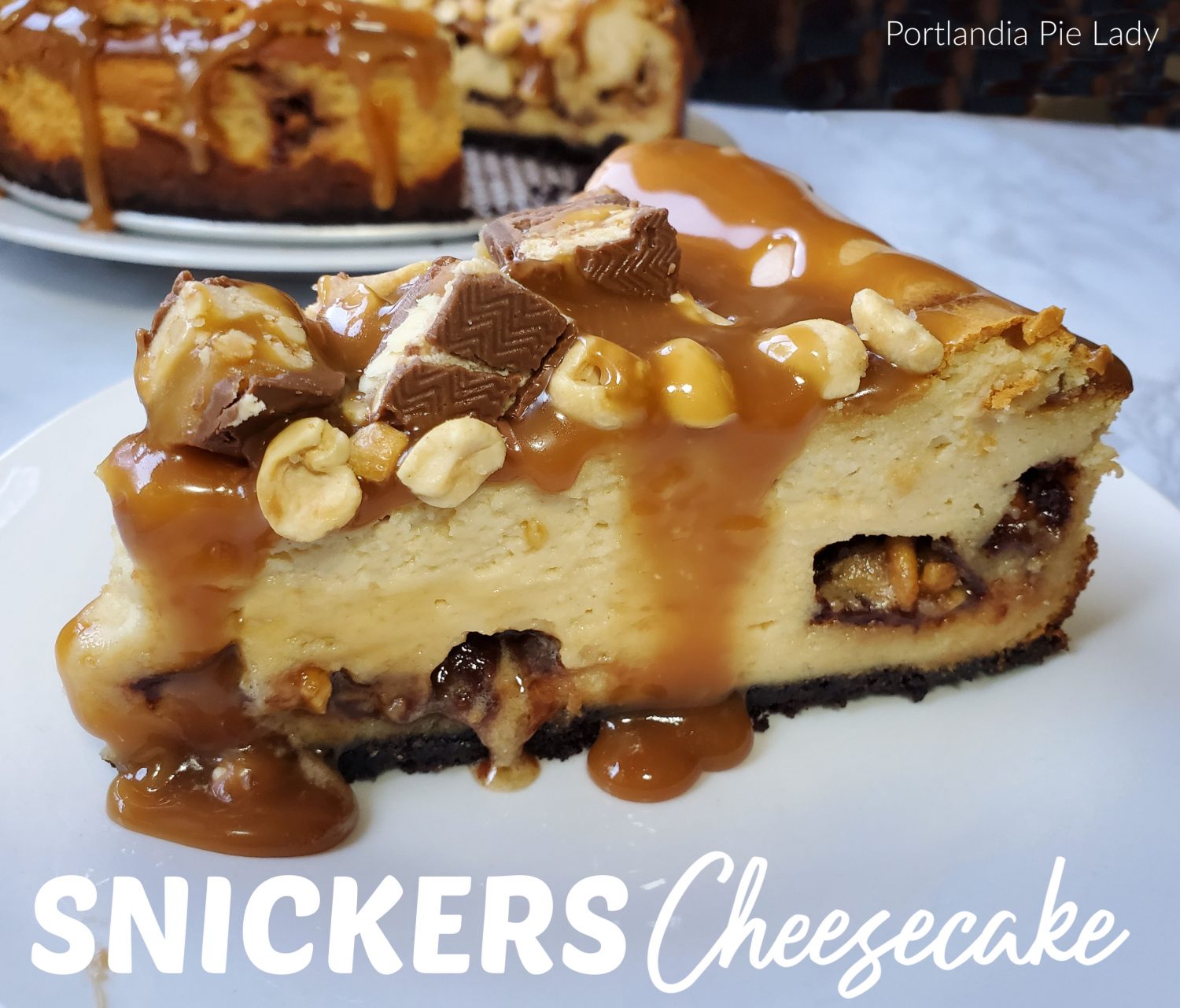 Snickers Cheescake, peanuty flavored filling loaded with Snickers and topped off with salted caramel sauce and roasted peanuts.  Dessert is great tonight!
