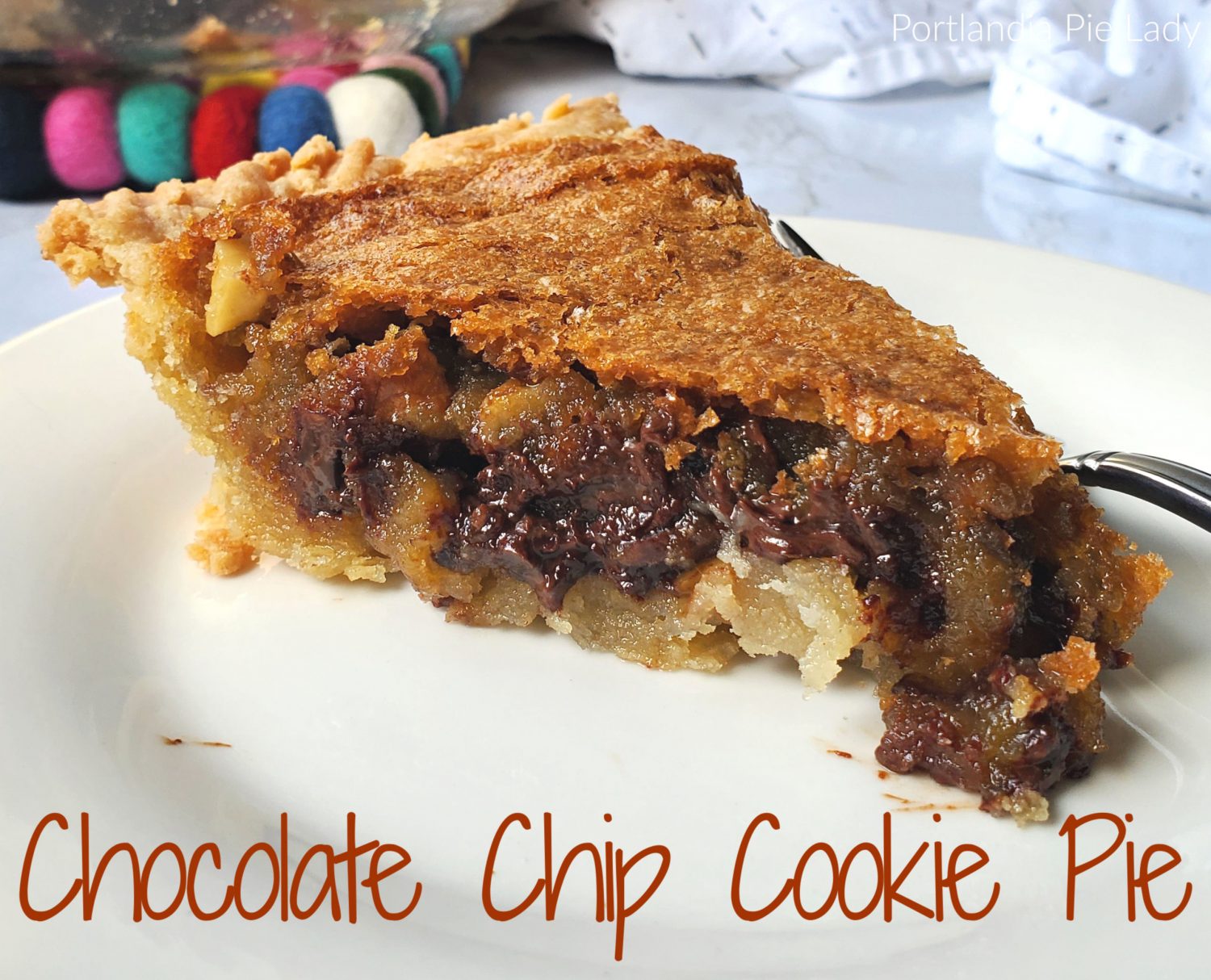 Gooey Chocolate Chip Cookie Batter Pie: Packed full of chocolate, walnuts, and a butter batter creating a gooey luscious filling and buttery flaky crust!