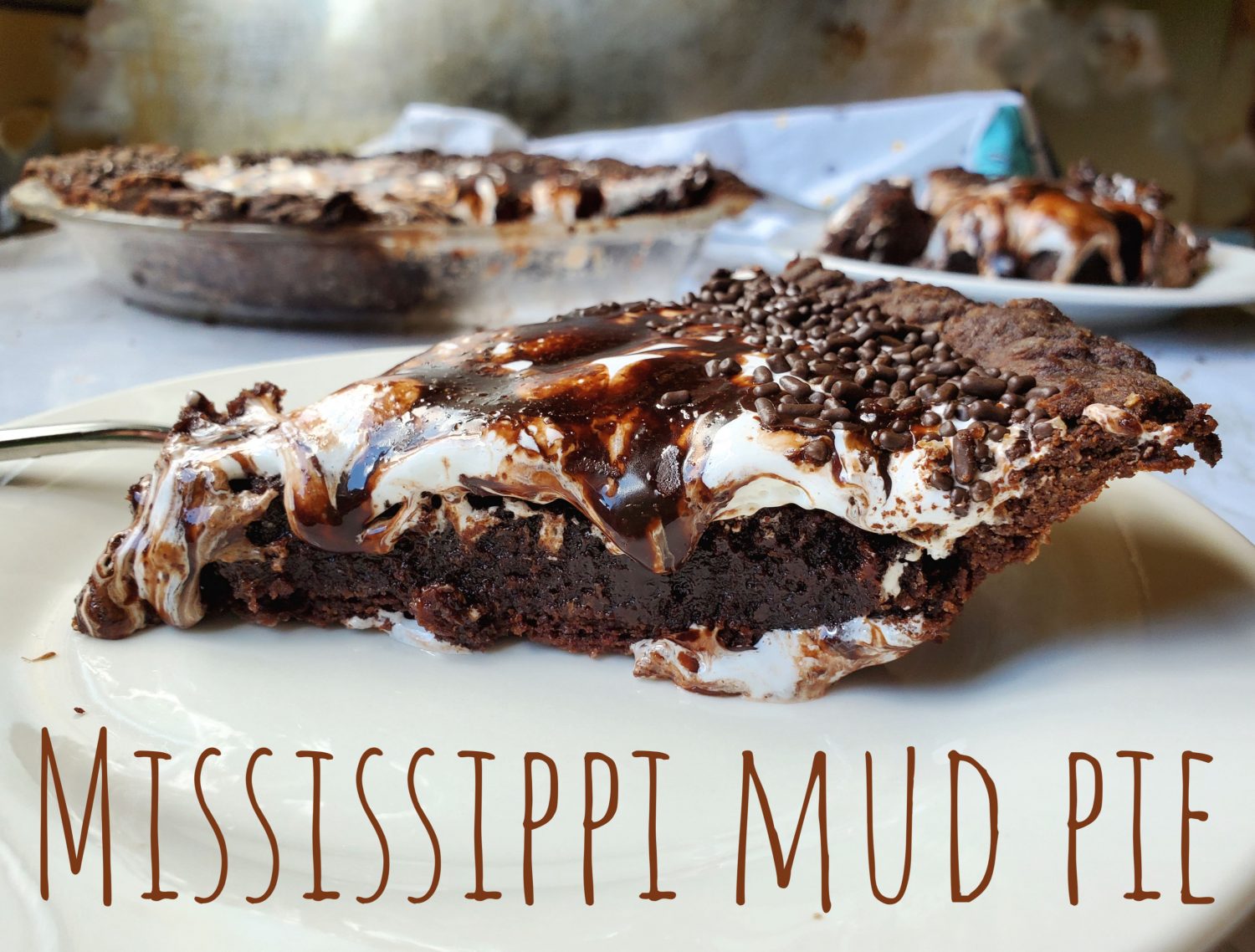 Mississippi Mid Pie: Dive into this ultra chocolaty gooey brownie pie filling, oozing with loads of marshmallow fluff, and dripping with a fudge icing sauce; be still my heart.