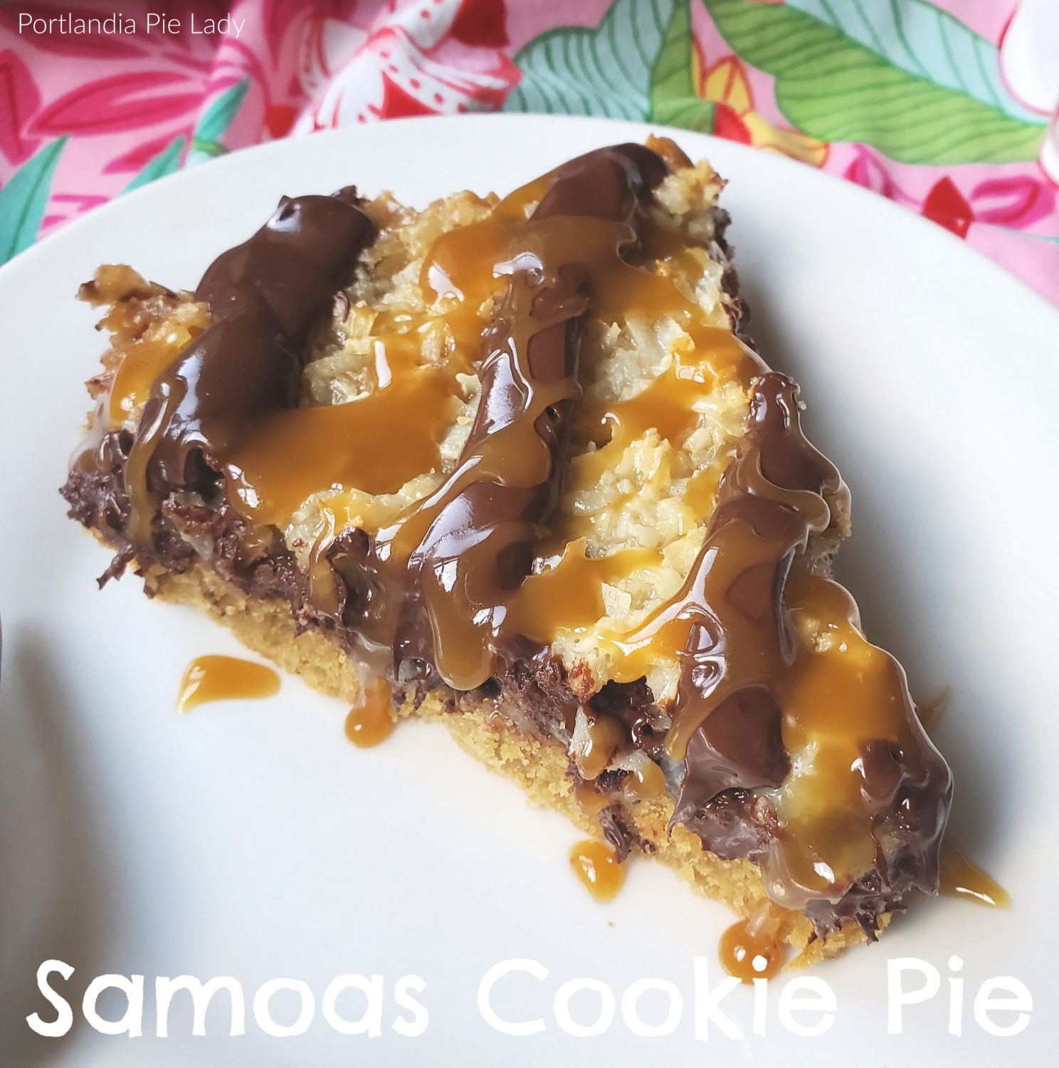 Samoas cookie pie with a homemade cookie crust, toasty coconut, salted caramel sauce and topped with chocolate stripes; no Girl Scout cookies required.