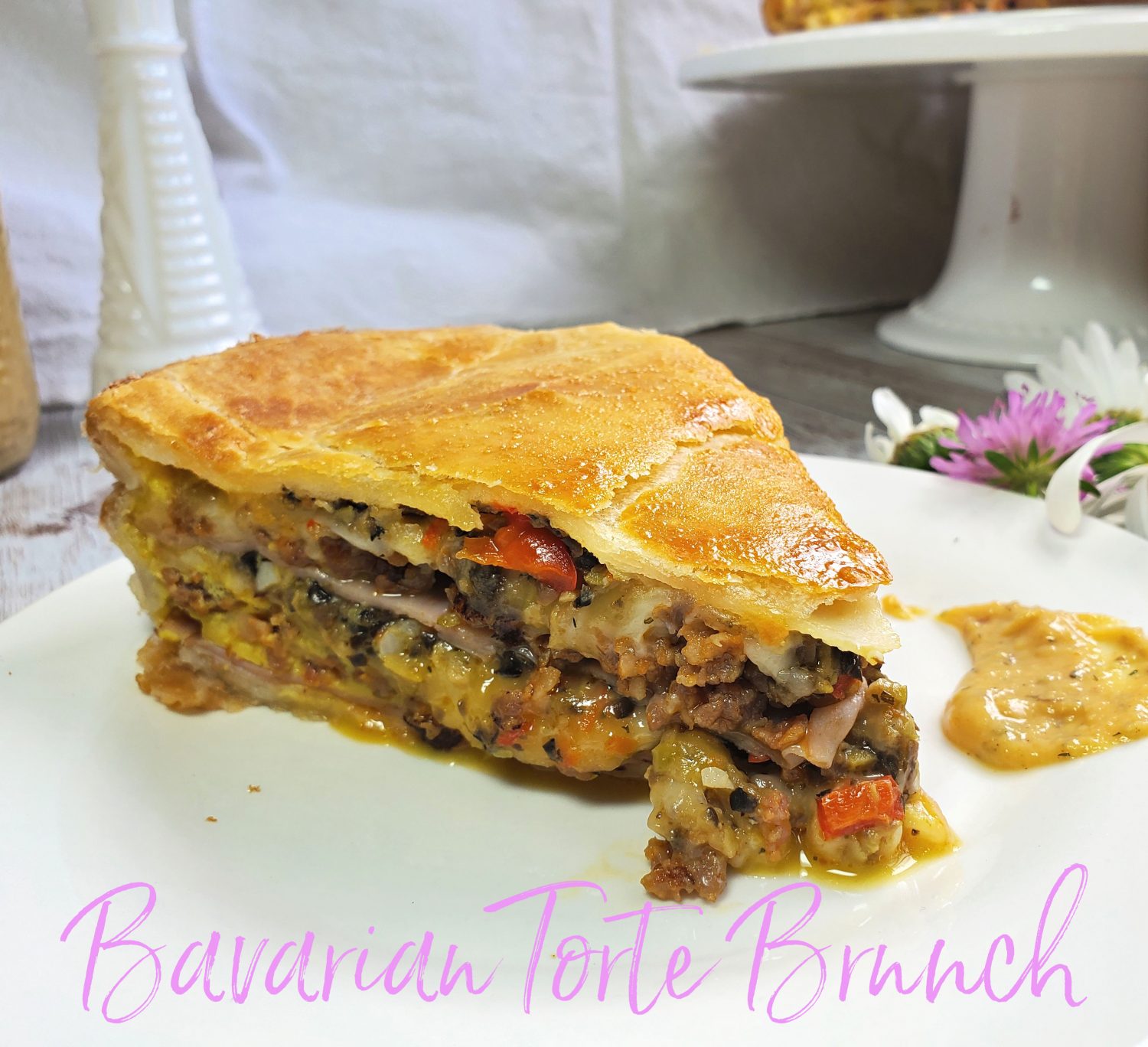 Bavarian Brunch Torte: A taste of Bavaria in a German inspired torte with smoky gouda, provolone, parmesan, honey ham, and homemade olive tapenade.