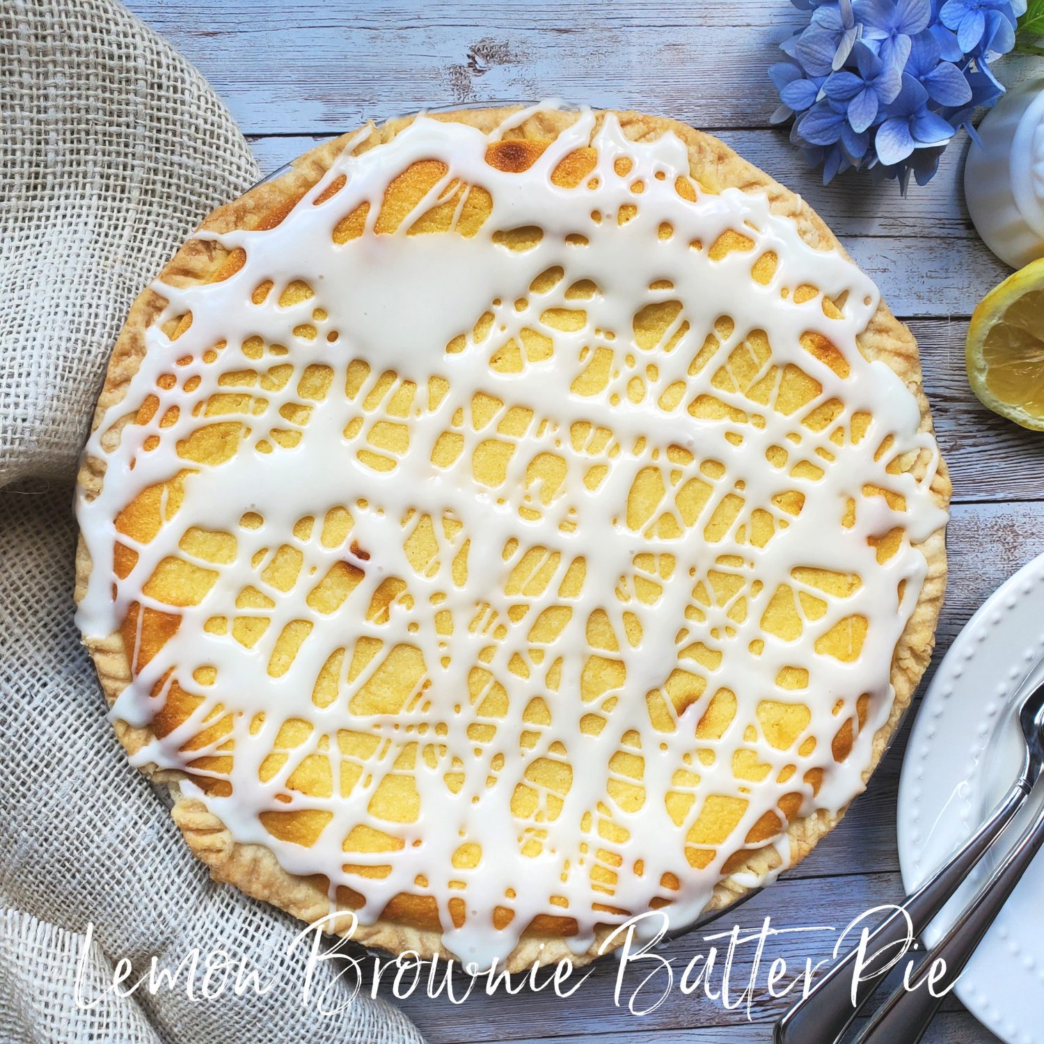 Lemon Brownie Batter Pie; a buttery lemon batter, luscious and deceivingly creamy, a kissing cousin of a lemon bar, topped with lemon glaze of course.