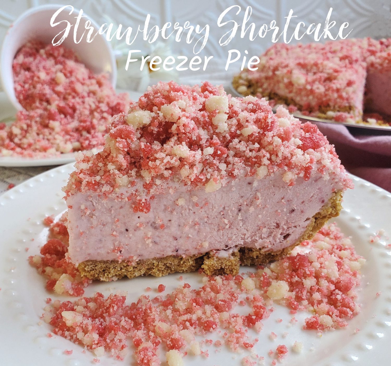 Strawberry Shortcake Freezer Pie: Homemade strawberry ice cream pie without any churning, and a pink punch of strawberry shortcake crumbles. Summer is getting tasty!