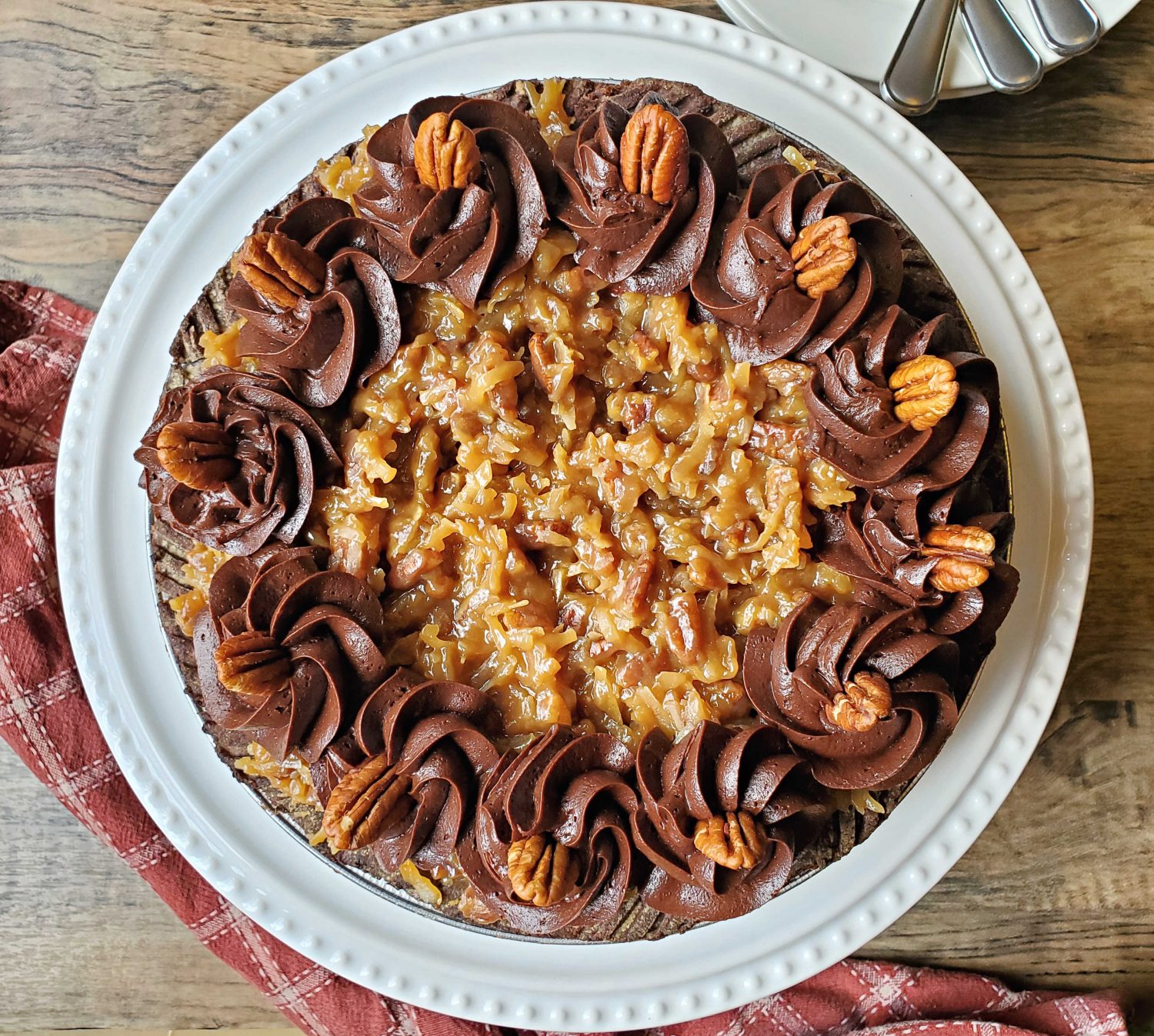 Decadent chocolate filling with toasted coconut and pecans, topped with sweet nutty topping & baked in an ultra-flaky chocolate crust.