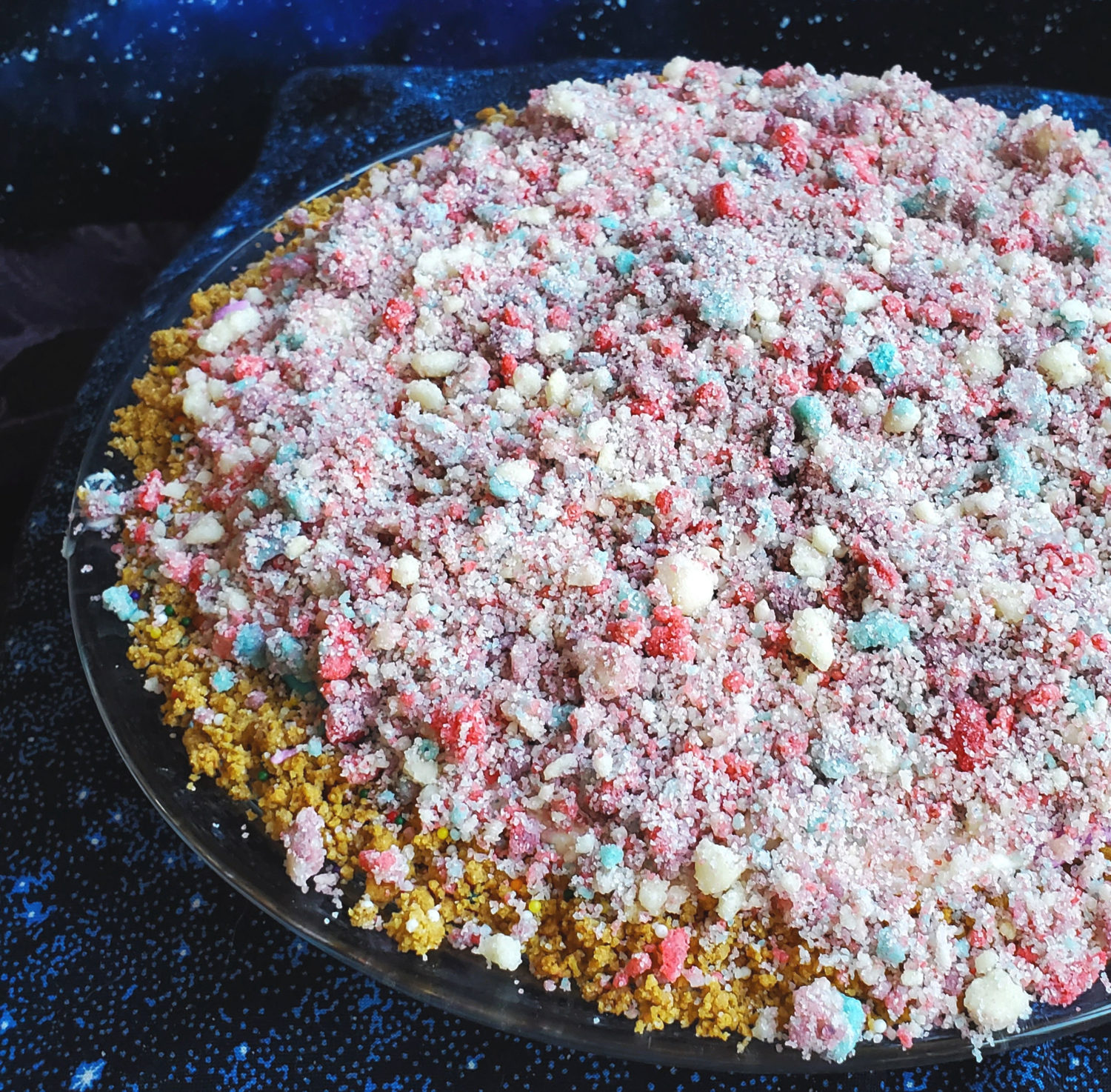 Marshmallow Moondust Pie: Creamy vanilla marshmallow filling with a swirl of color and topped with homemade fruity moondust crumbles.  
