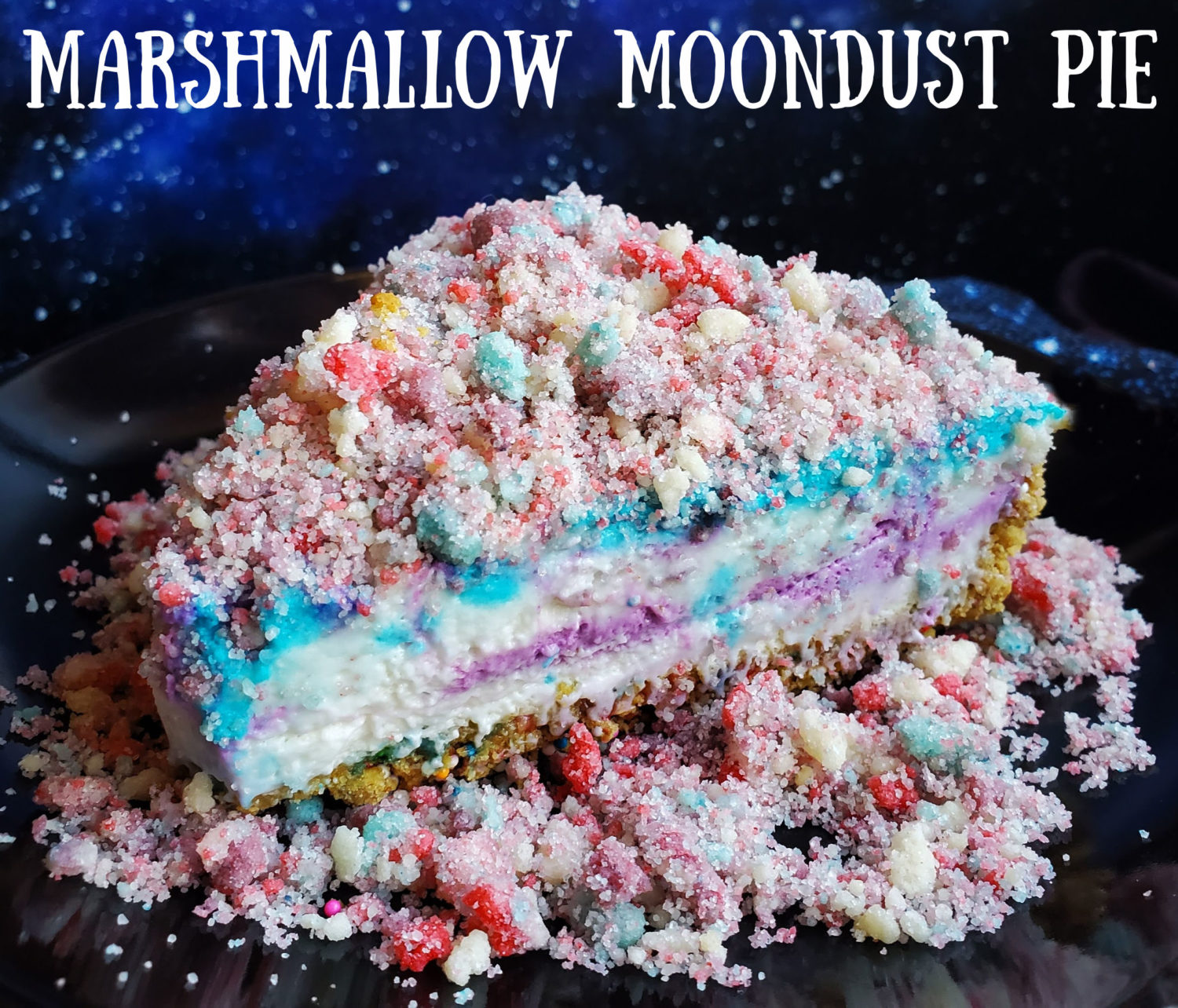 Marshmallow Moondust Pie: Creamy vanilla marshmallow filling with a swirl of color and topped with homemade fruity moondust crumbles.  