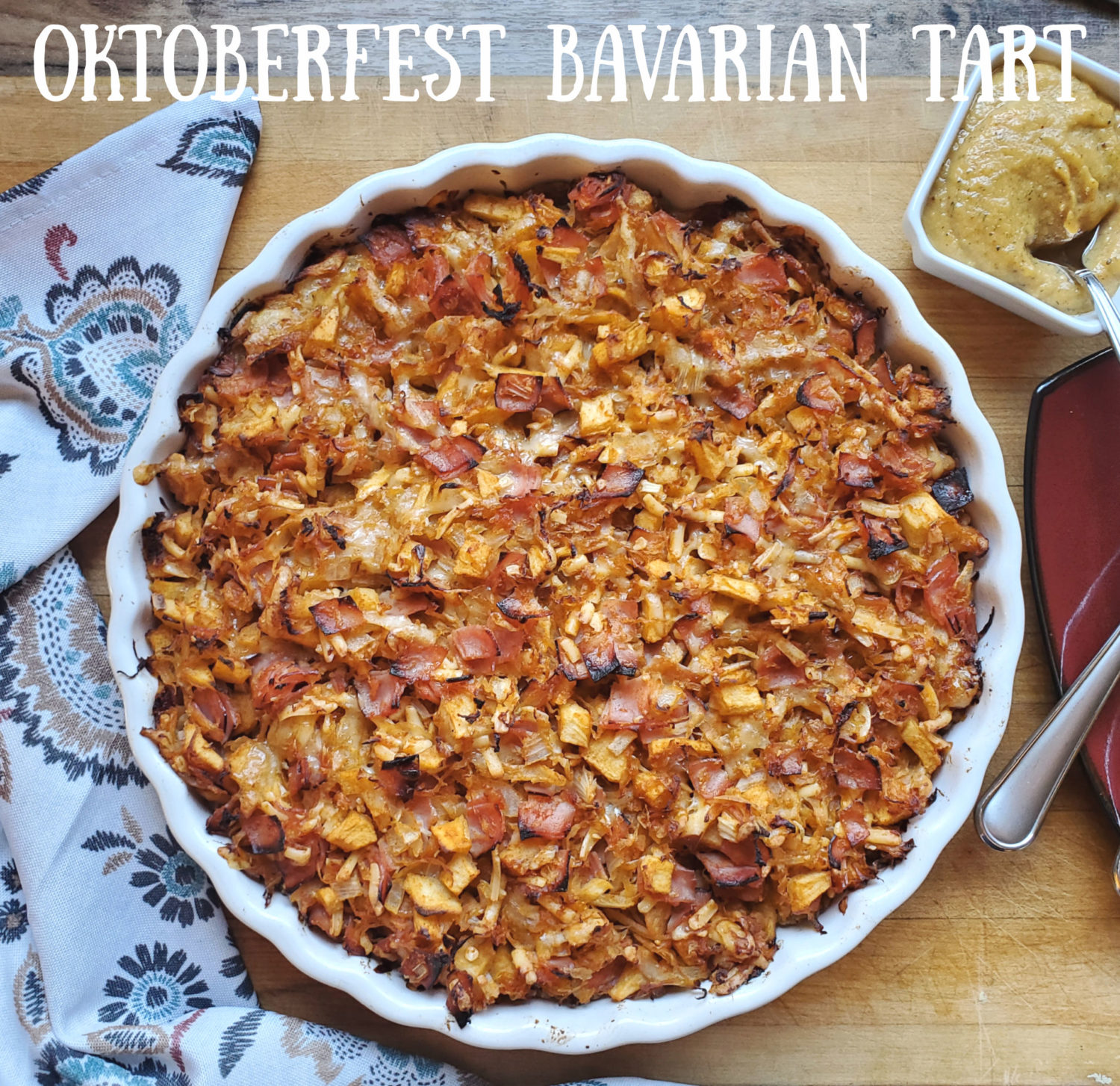 Oktoberfest Bavarian Tart: seasoned potato crust, topped with a mixture of sweet-tart apples, sauerkraut, ham & smoked gouda & swiss cheese.  