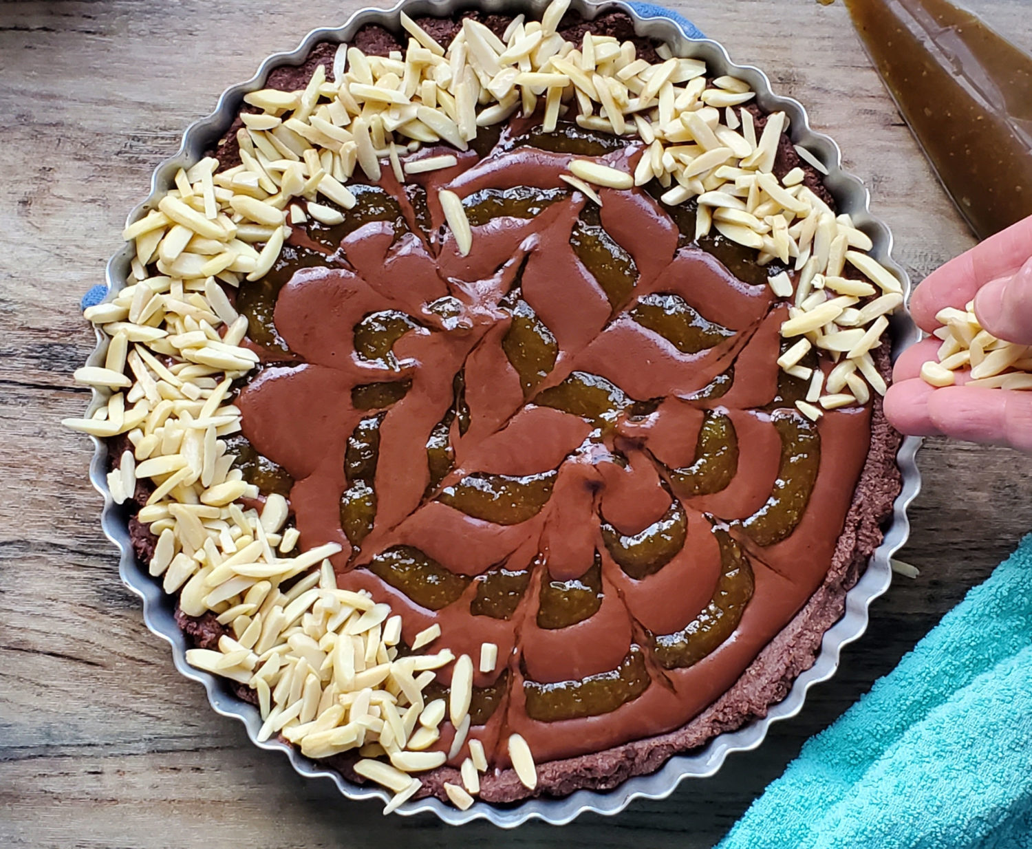 Chocolate Fig Tart: Coconut chocolate ganache & fig jam in an Almond Cocoa Crust & loads of slivered almonds. Fruity, chocolatey & nutty. Vegan never tasted so sinfully delicious!