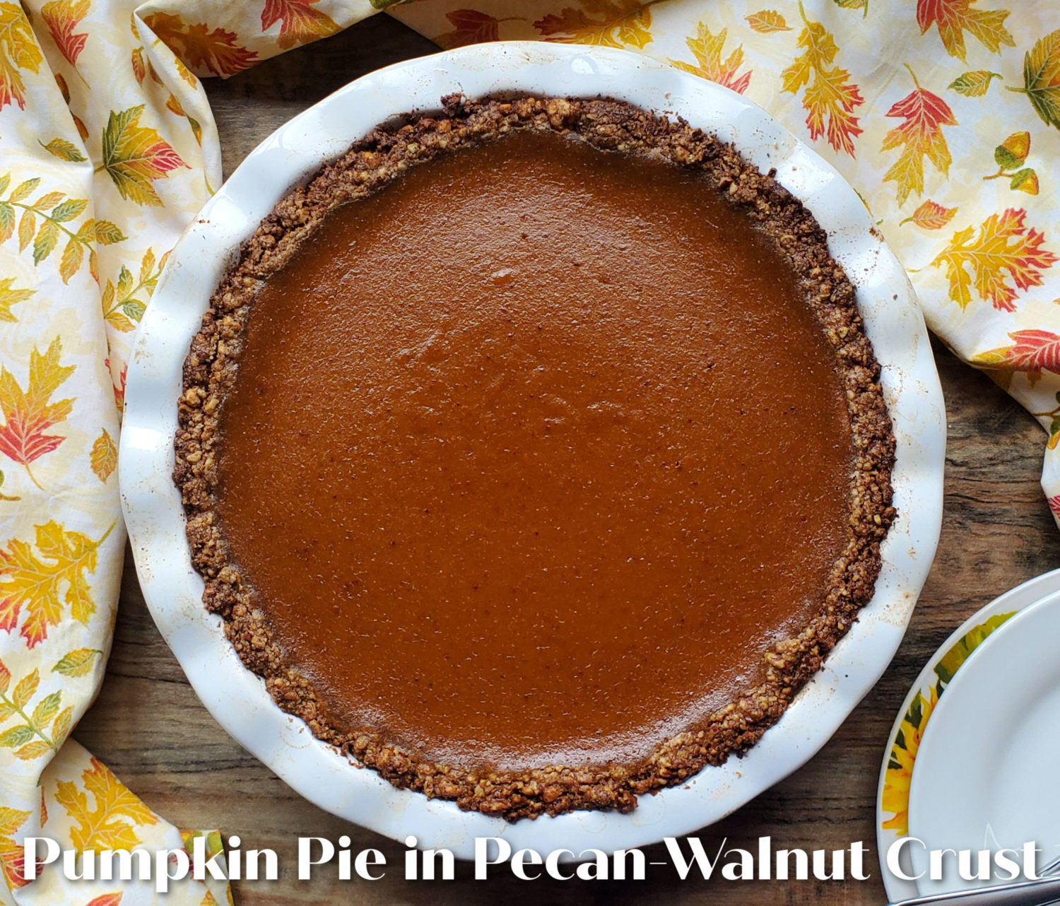 Pumpkin Pie with Pecan Walnut Crust: The best of both worlds in the fall, buttery toasted sizzling nut crust with perfectly spice pumpkin custard filling. 