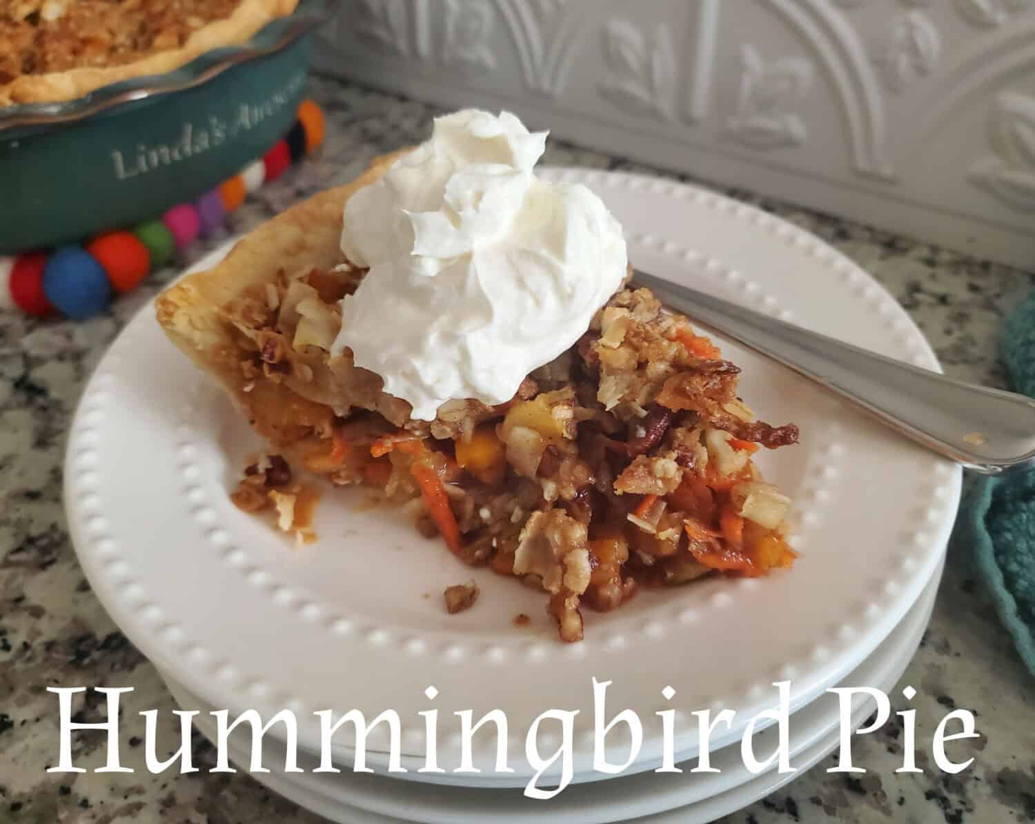 Hummingbird Pie: Tropical fruit, spices, pecans, lightly sweetened with a brown sugar, coconut-pecan crumble, and cream cheese whipped cream.