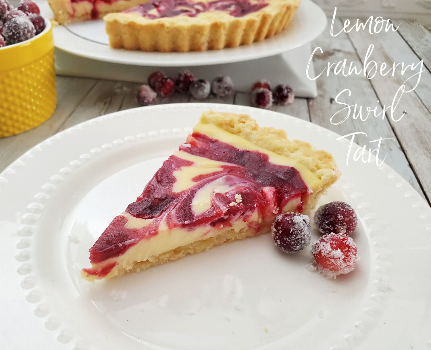 Creamy lemon filling ever with homemade cranberry orange-infused jam in a buttery shortbread crust, topped with luscious sugared cranberries.