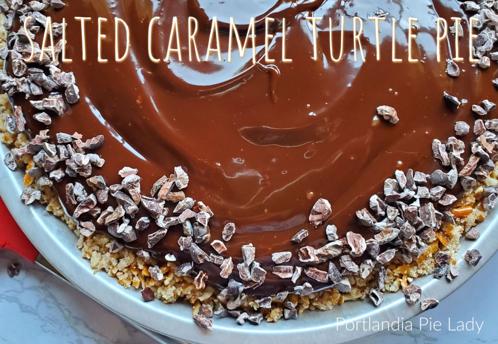 Salted Caramel Turtle Pie is full of toasted pecans, decadent creamy salted caramel, chocolate ganache in a crispy pretzel crust.