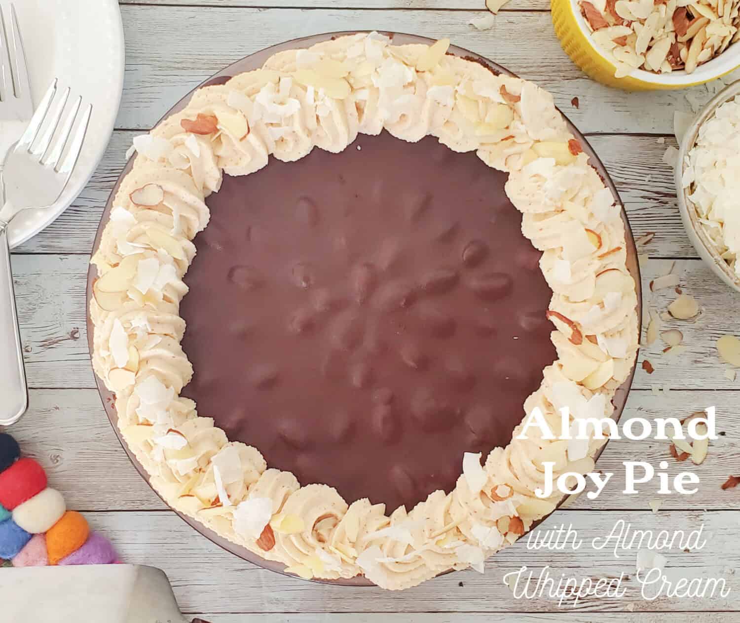 Almond Joy pie, creamy coconut filling, salted almonds, smothered in chocolate ganache & almond whipped cream in a chocolate cookie crust. 