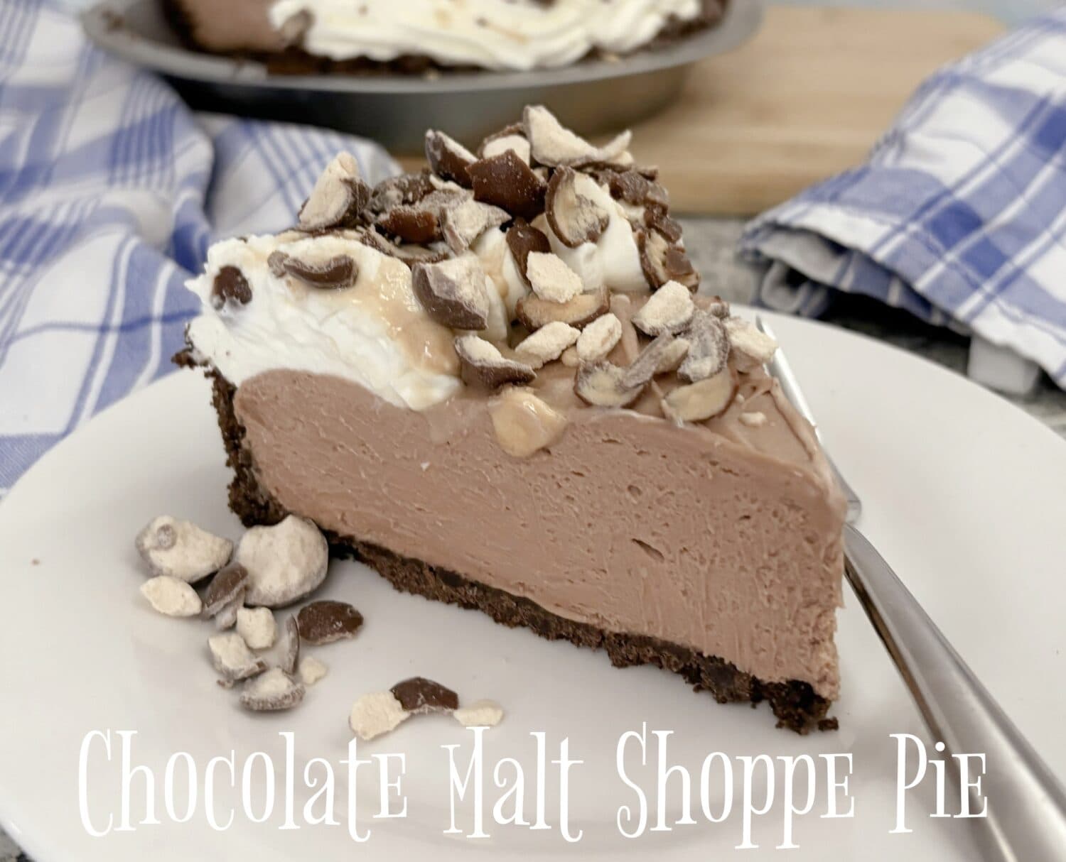 Chocolate Malt Pie, creamy chocolate malt marshmallow-cream cheese filling., with whipped cream; garnished with crushed malted milk balls.