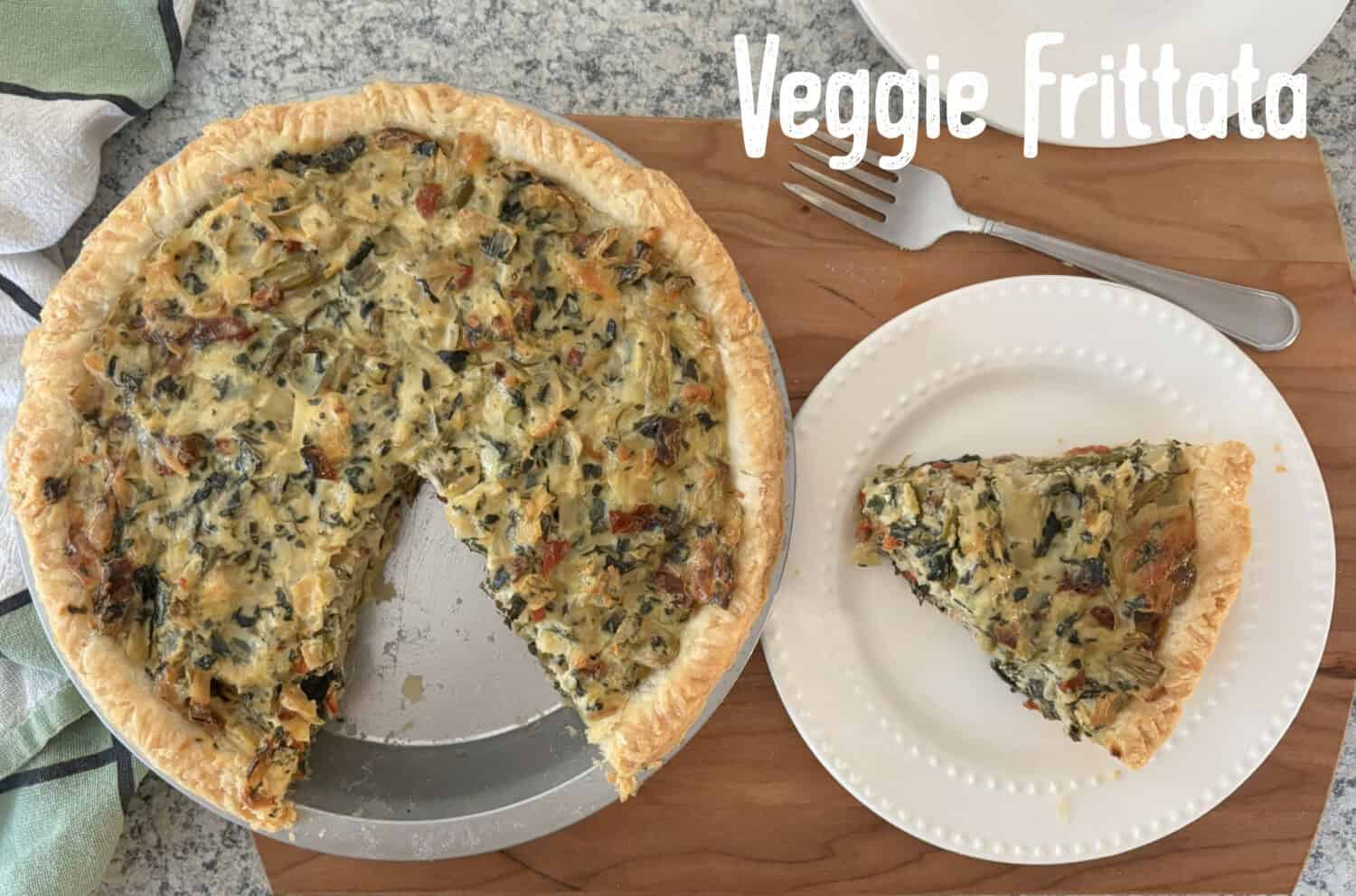 Veggie Frittata: Loads of sweet onions, asparagus, & spinach baked with parmesan and swiss cheeses in a savory egg-sour cream filling.