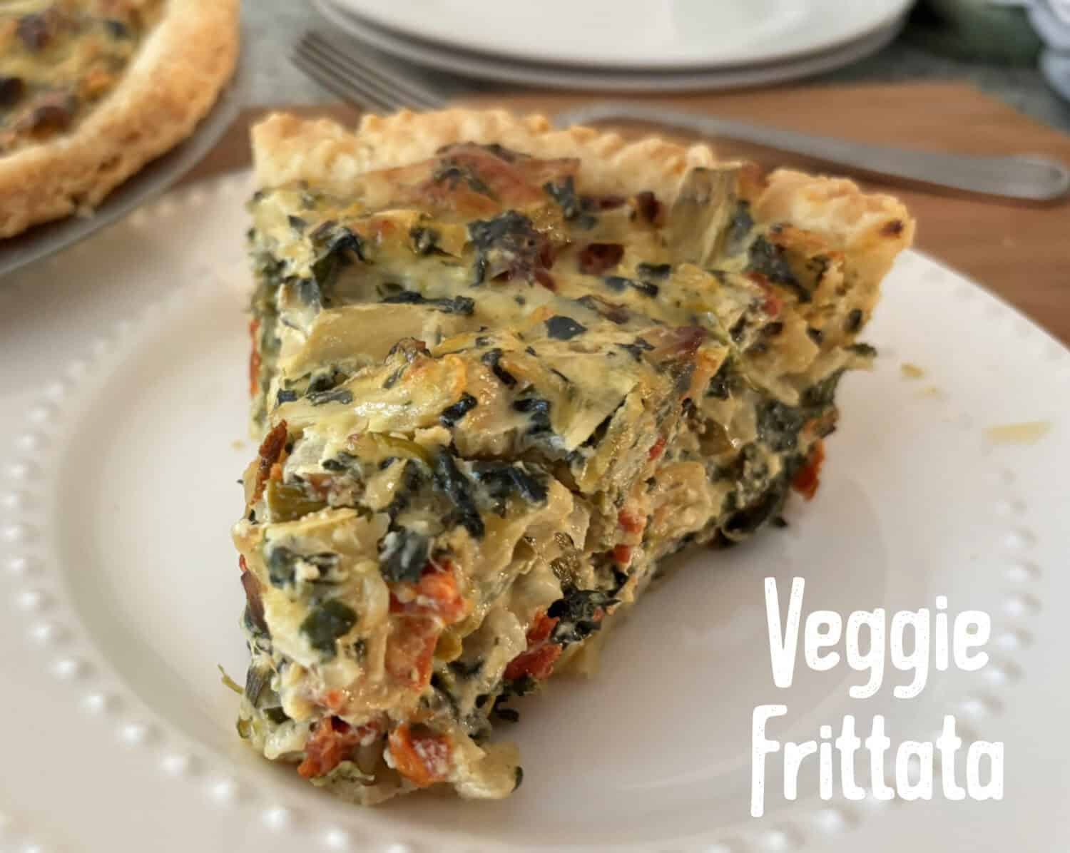 Veggie Frittata: Loads of sweet onions, asparagus, & spinach baked with parmesan and swiss cheeses in a savory egg-sour cream filling.