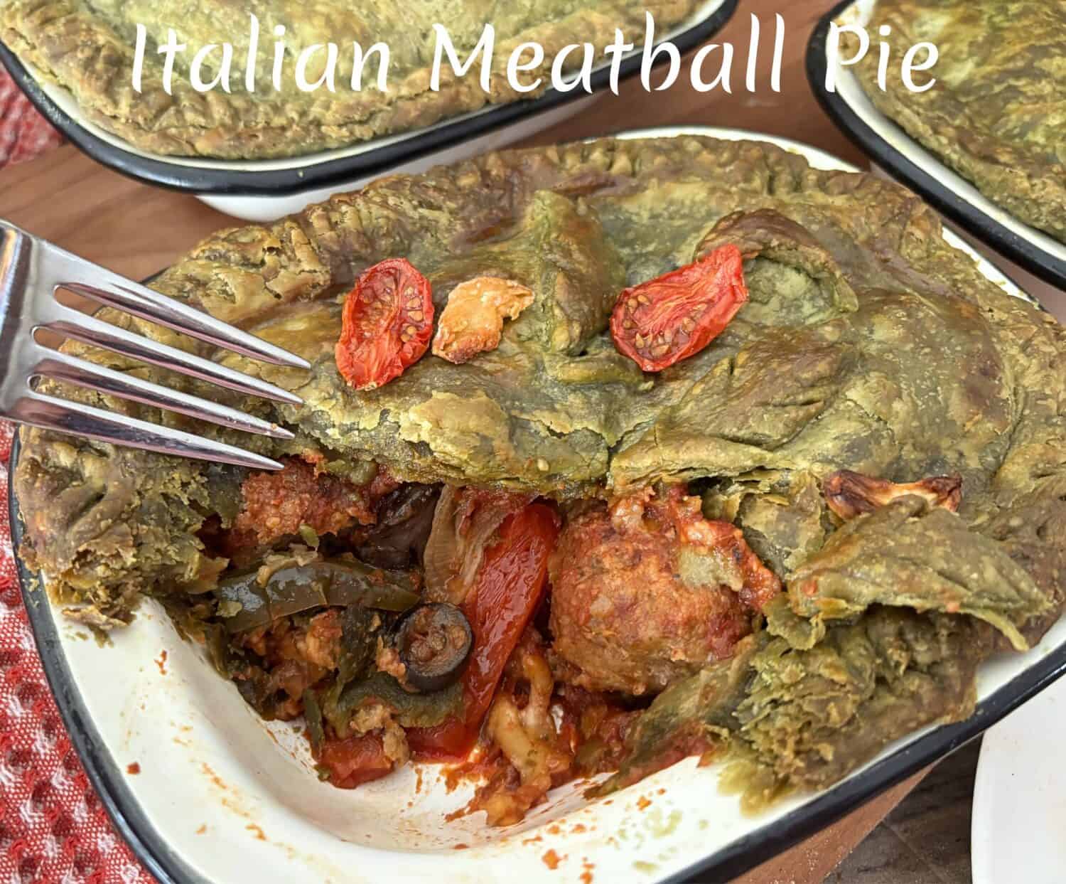 Italian Meatballs paired marinara sauce, Italian cheeses and veggies, all baked in a spinach pastry crust. It's where pizza meets spaghetti and meatballs in an Italian pot pie feast. 