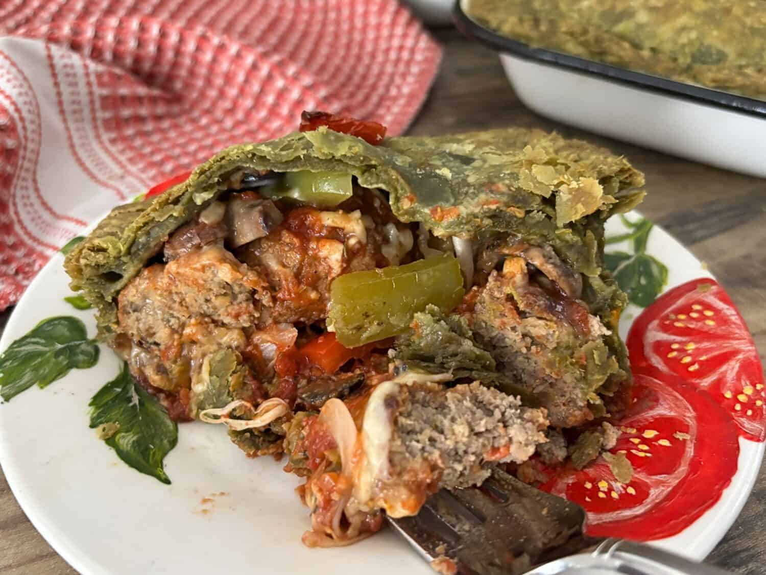 Italian Meatballs paired marinara sauce, Italian cheeses and veggies, all baked in a spinach pastry crust. It's where pizza meets spaghetti and meatballs in an Italian pot pie feast. 