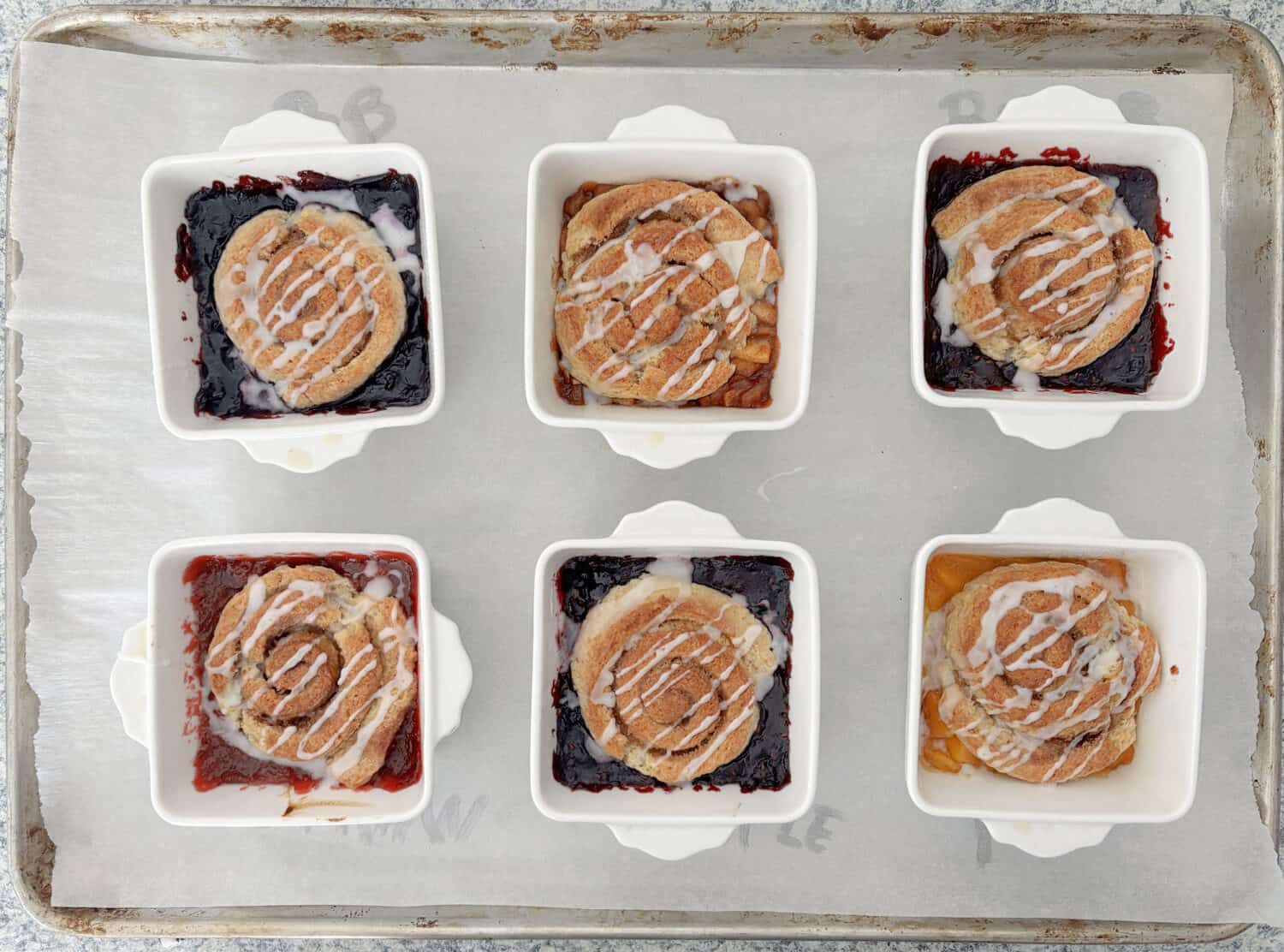 Pie Roll Scobbler is the quintessential culmination of Pie + Cinnamon Roll + Scone + Cobbler, with homemade (or ready made) pie filling.