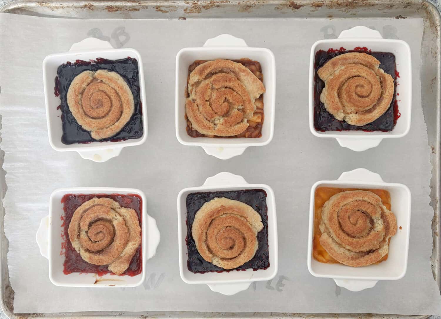 Pie Roll Scobbler is the quintessential culmination of Pie + Cinnamon Roll + Scone + Cobbler, with homemade (or ready made) pie filling.