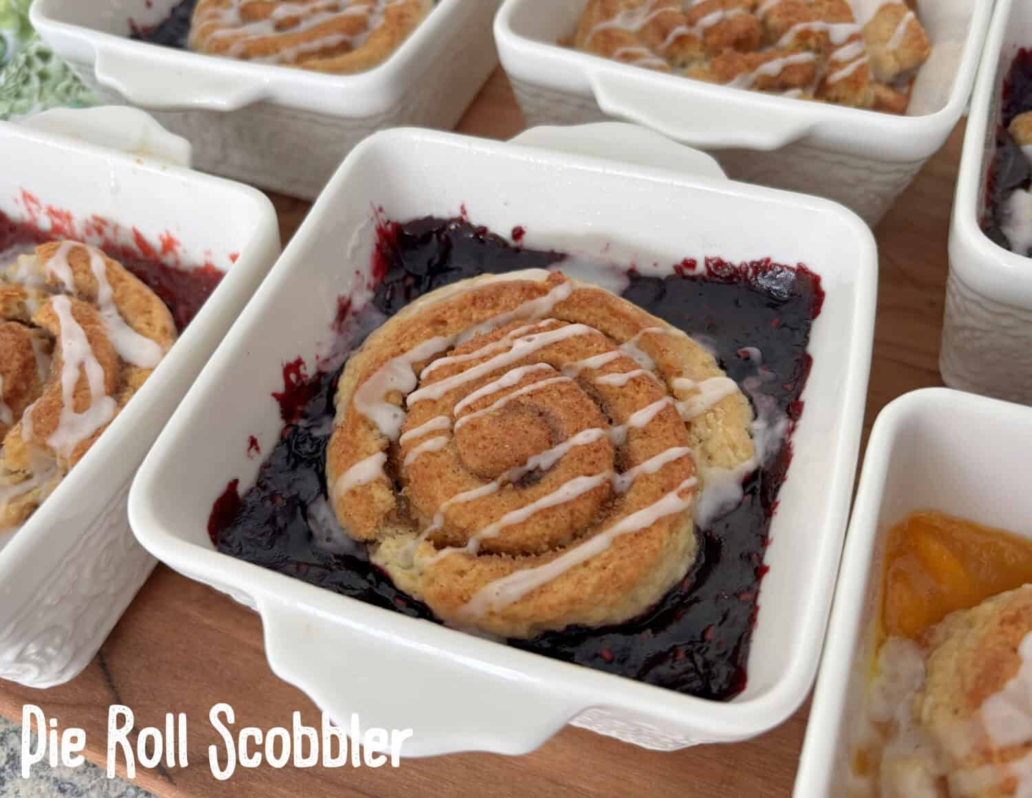 Pie Roll Scobbler is the quintessential culmination of Pie + Cinnamon Roll + Scone + Cobbler, with homemade (or ready made) pie filling.
